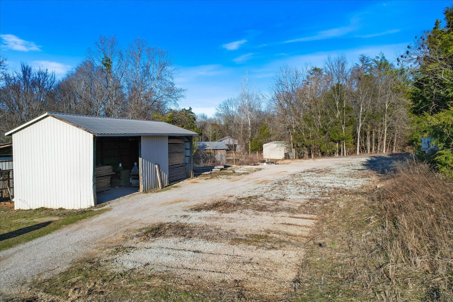 3160 Tom Holt Road Clifton, TN 38425 - Photo 49 of 53 a view of a house with a yard covered in snow
