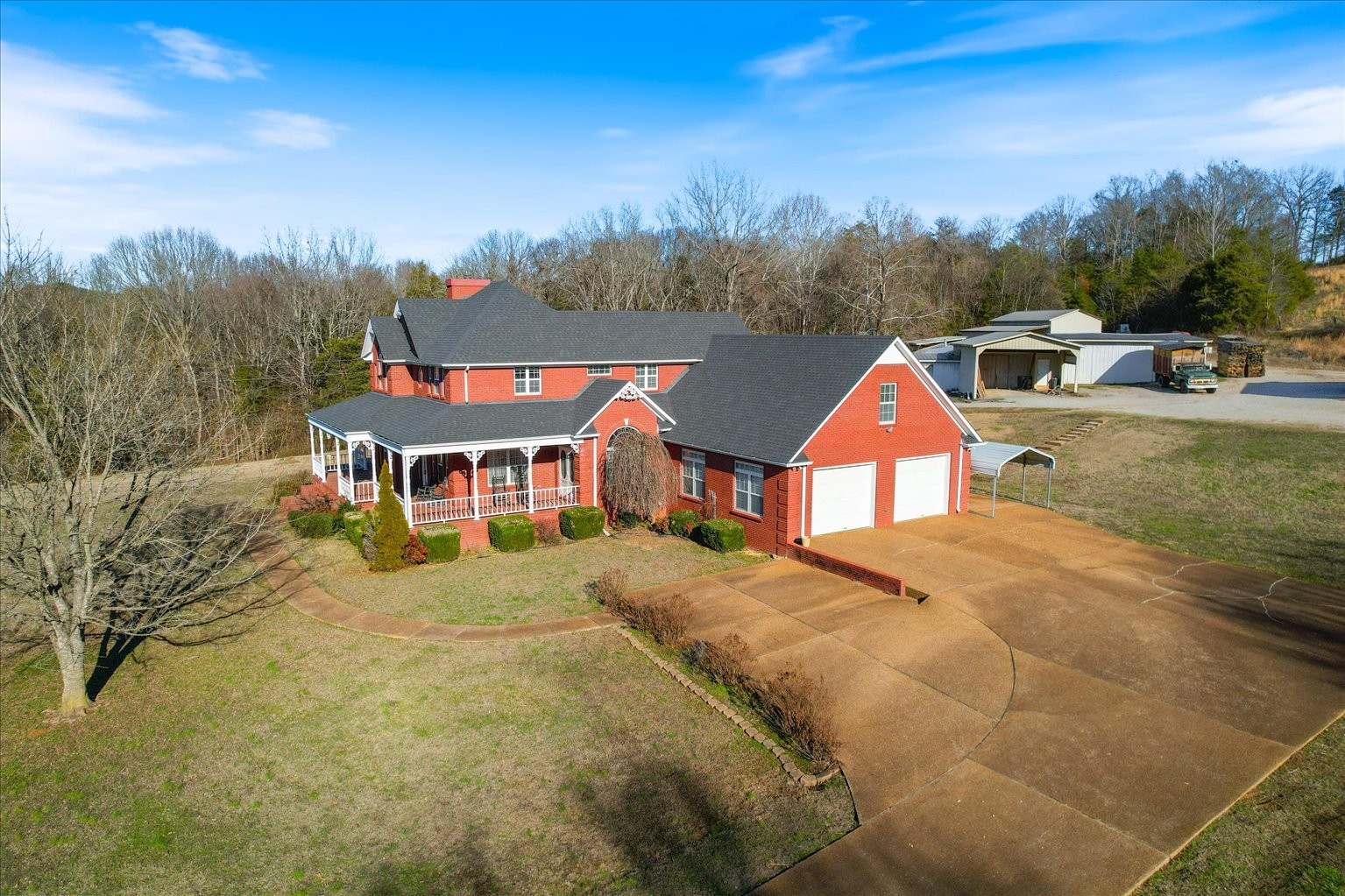 3160 Tom Holt Road Clifton, TN 38425 - Photo 5 of 53 a aerial view of a house with a garden and trees