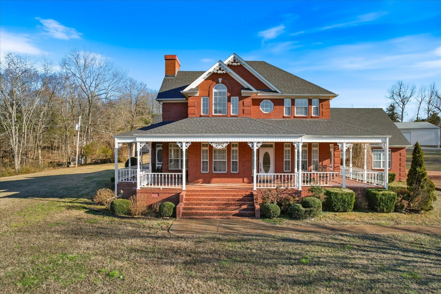 3160 Tom Holt Road Clifton, TN 38425 - Photo 6 of 53 a front view of a house with a yard