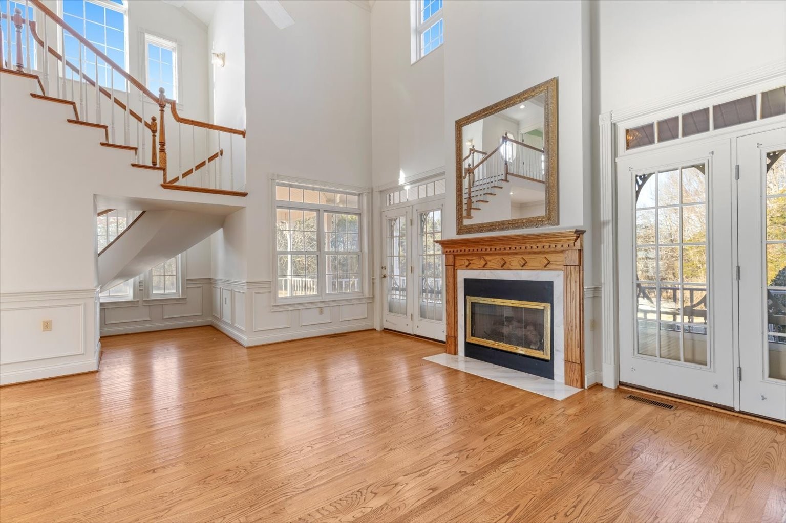 3160 Tom Holt Road Clifton, TN 38425 - Photo 10 of 53 a view of an empty room with wooden floor fireplace and a window