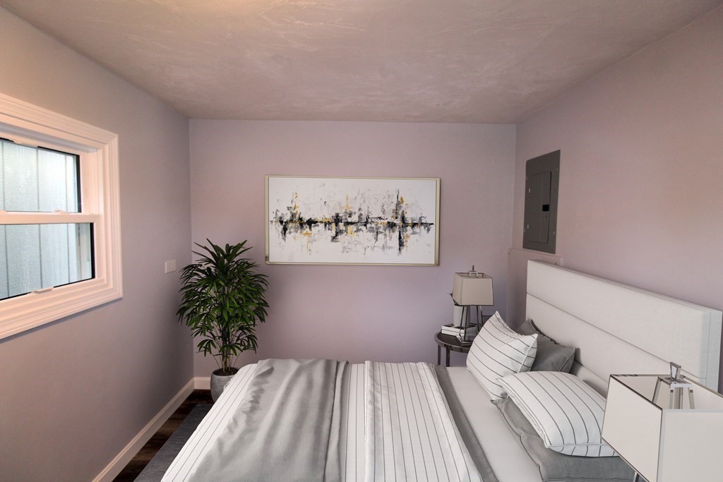 11 Groton School Road, Unit 4 Ayer, MA 01432 - Photo 5 of 11 a bedroom with a large bed and a potted plant