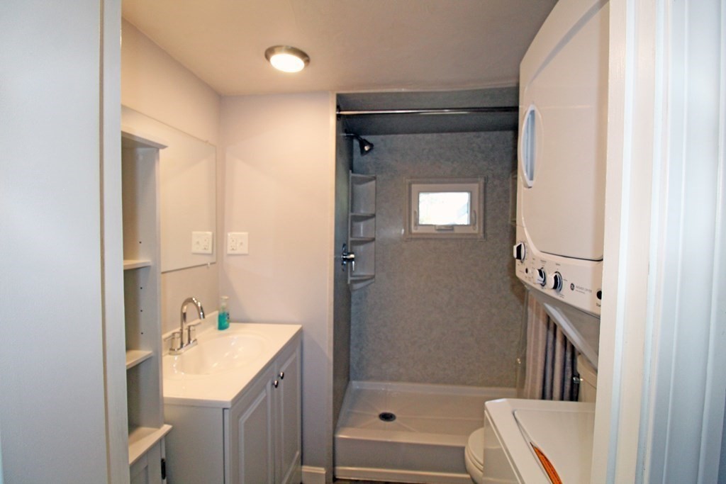11 Groton School Road, Unit 4 Ayer, MA 01432 - Photo 7 of 11 a bathroom with a tub sink and mirror