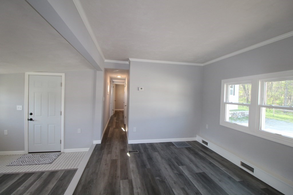 11 Groton School Road, Unit 4 Ayer, MA 01432 - Photo 8 of 11 a view of a room with wooden floor and a window