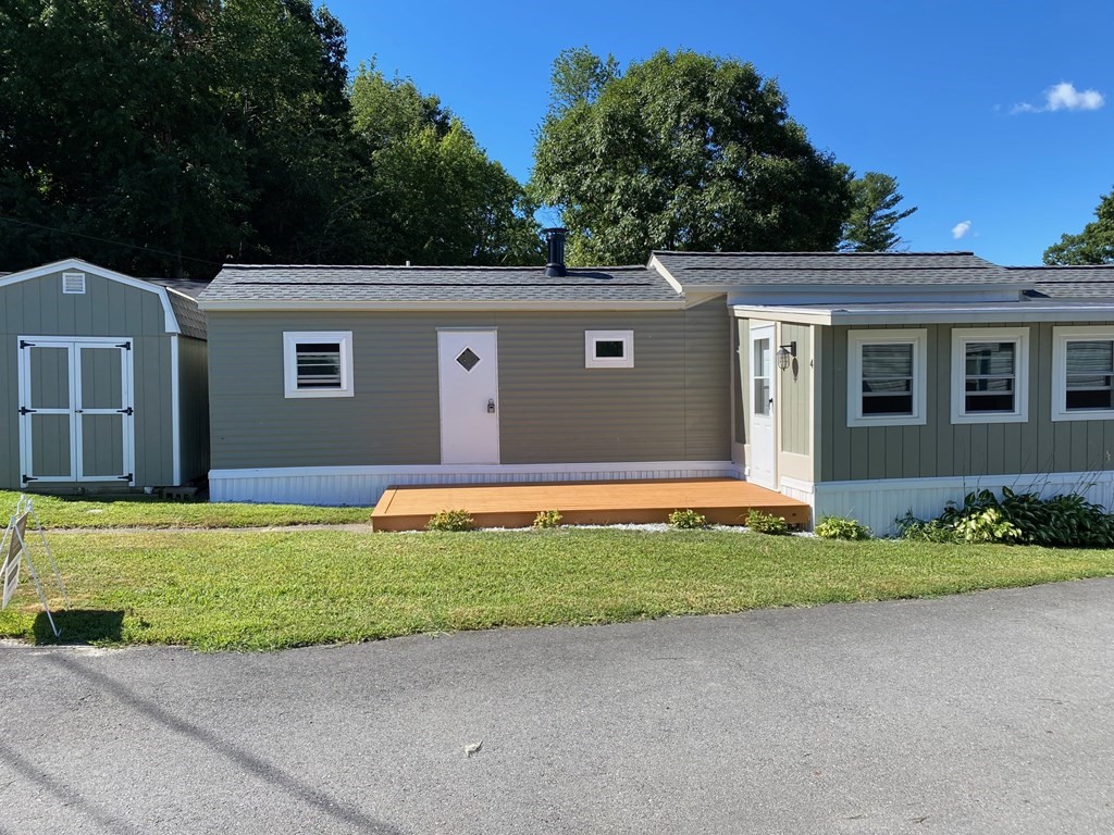11 Groton School Road, Unit 4 Ayer, MA 01432 - Photo 9 of 11 a view of a house with a backyard