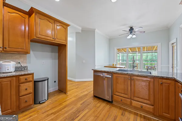 a view of a livingroom with furniture and a window