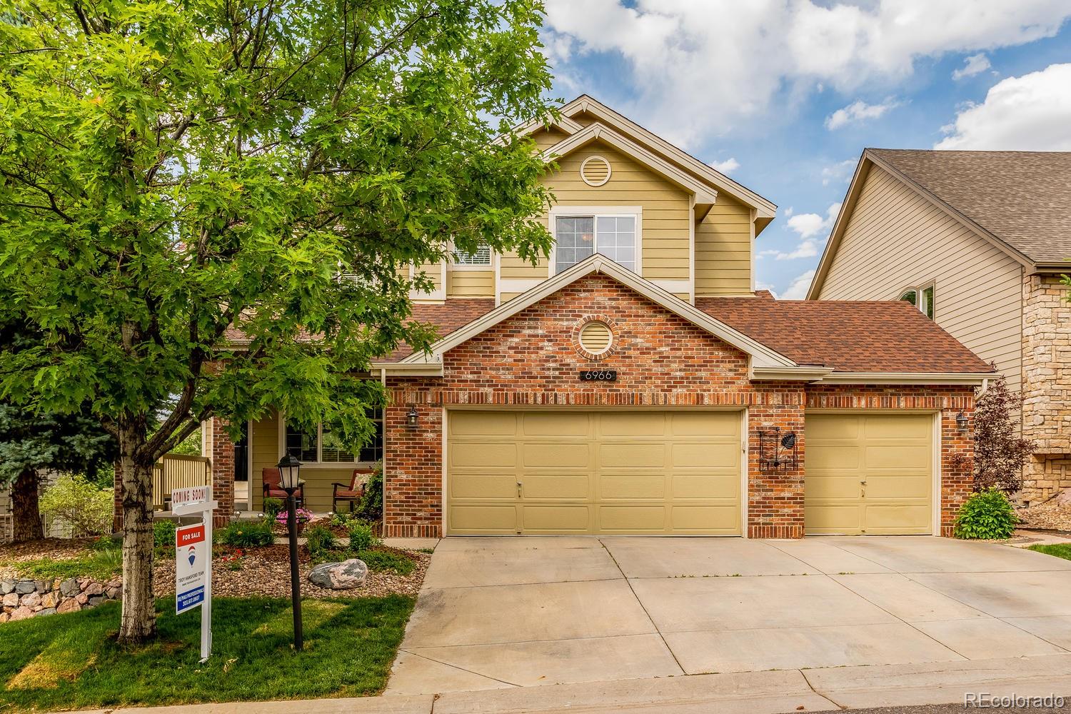 6966 South Riviera Street Aurora, CO 80016 - Photo 1 of 30 a front view of a house with garden