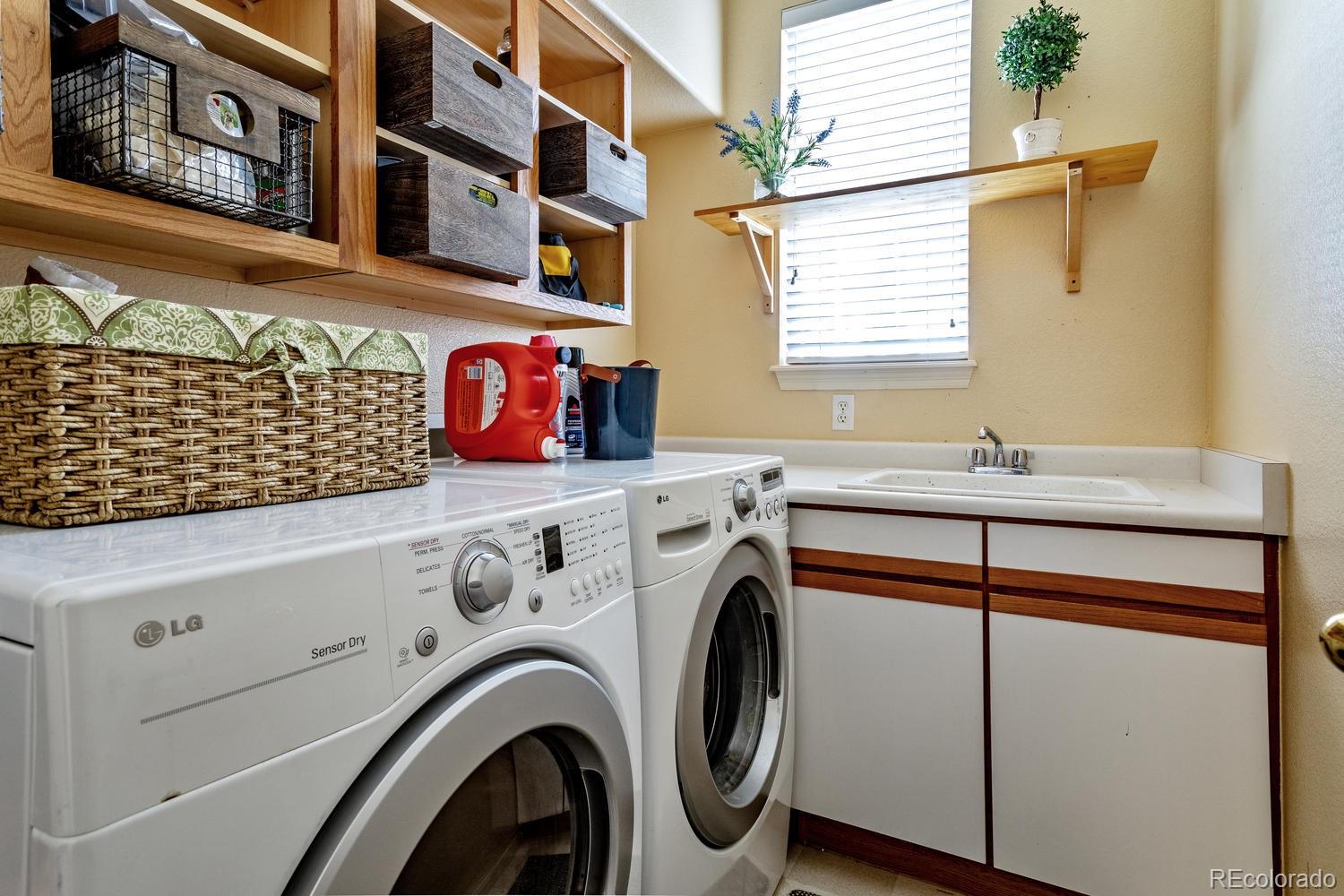 6966 South Riviera Street Aurora, CO 80016 - Photo 13 of 30 a utility room with dryer and washer