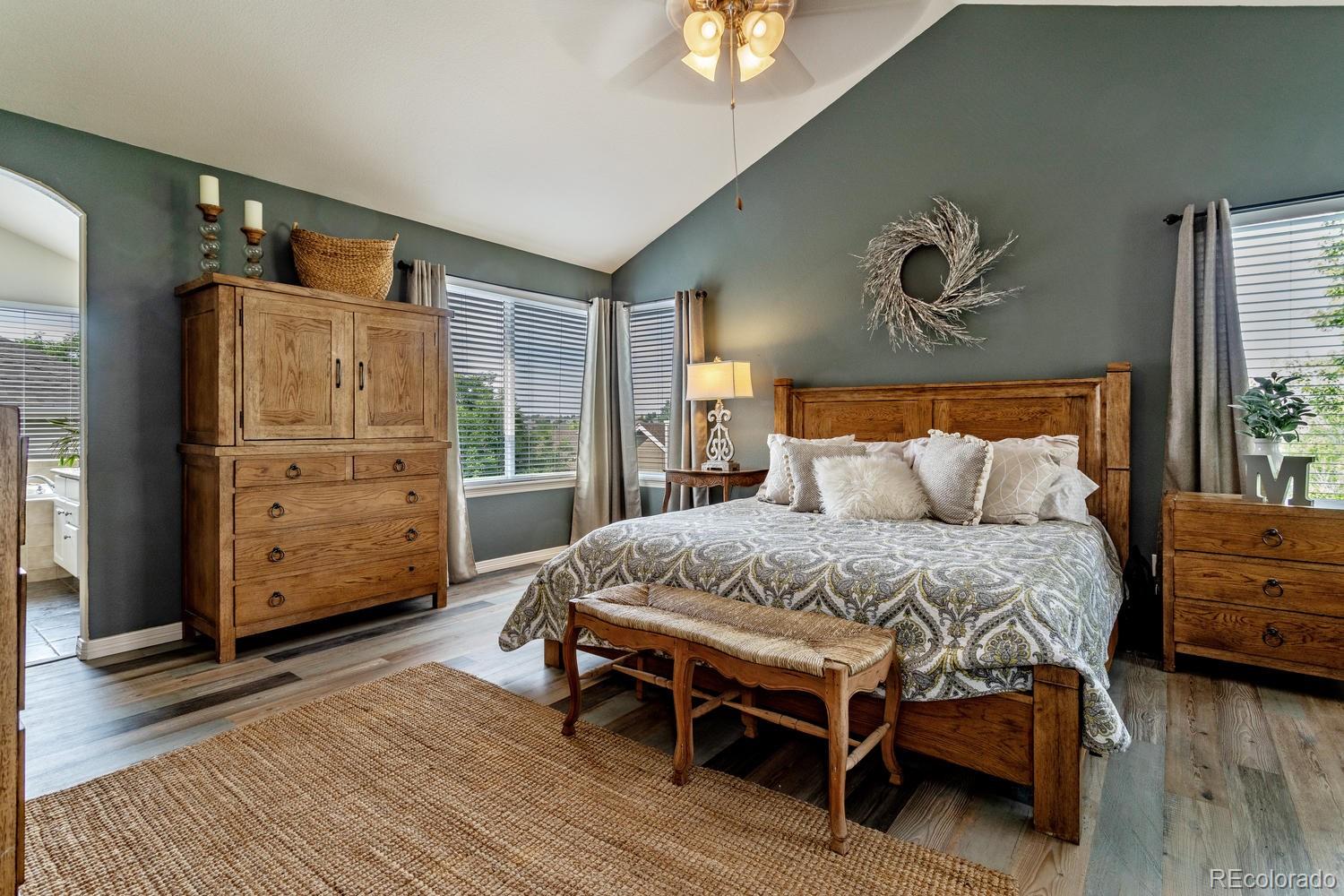 6966 South Riviera Street Aurora, CO 80016 - Photo 15 of 30 a bedroom with a bed and a dresser