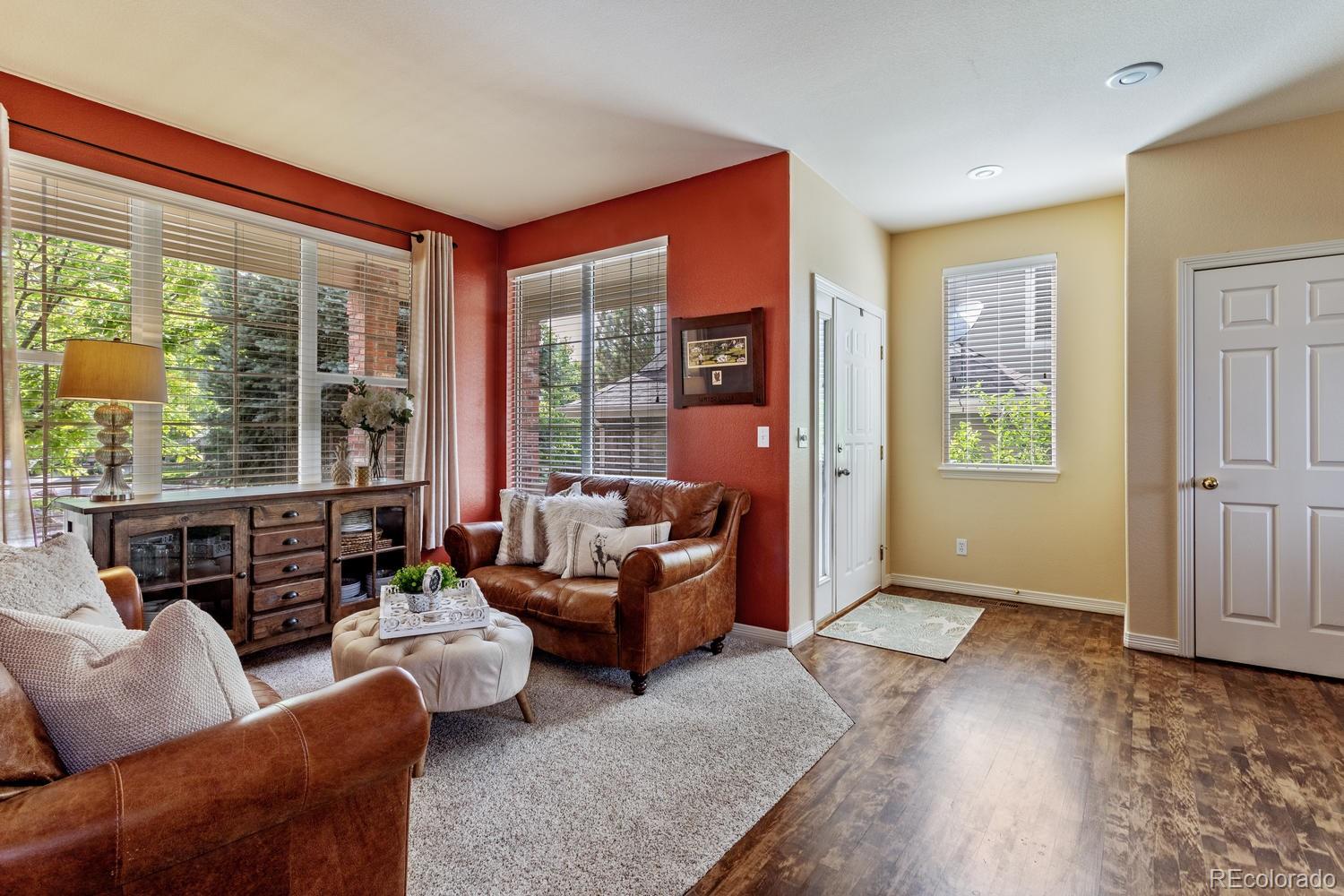 6966 South Riviera Street Aurora, CO 80016 - Photo 6 of 30 a living room with furniture and a large window