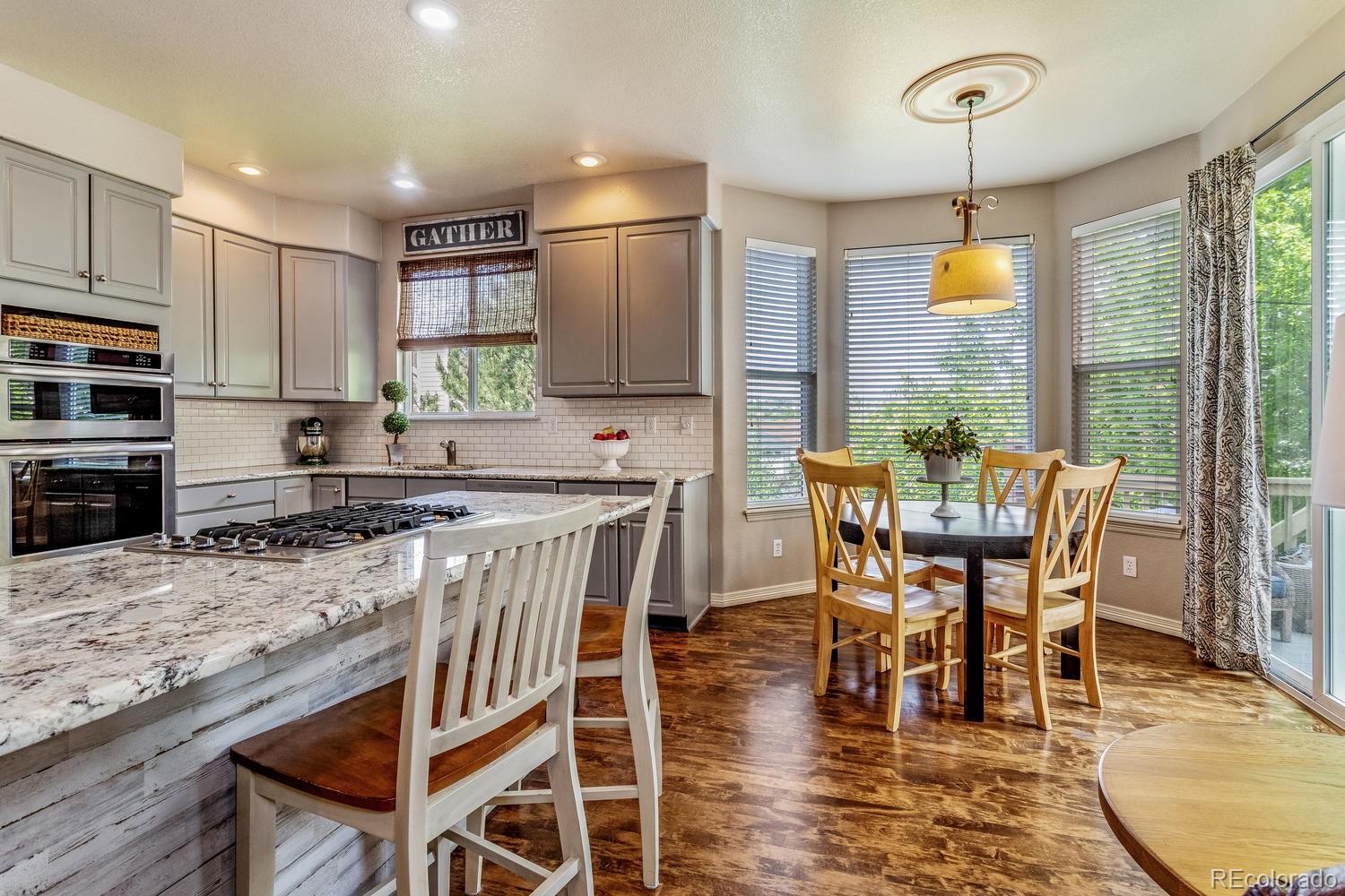 6966 South Riviera Street Aurora, CO 80016 - Photo 8 of 30 a view of a dining room with furniture window and outside view