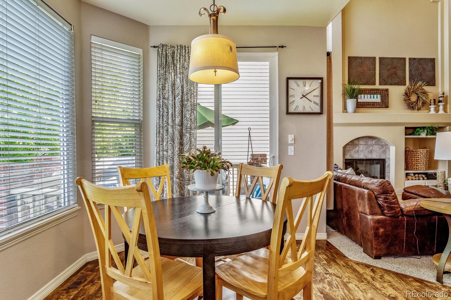 6966 South Riviera Street Aurora, CO 80016 - Photo 9 of 30 a view of a dining room with furniture and window