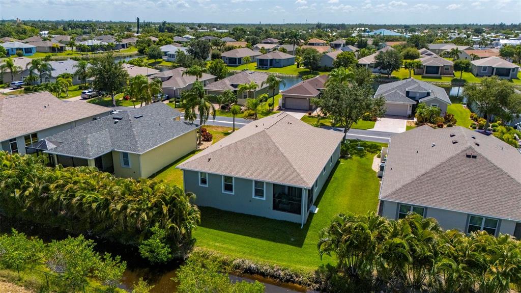 24604 Rio Villa Lakes Circle Punta Gorda, FL 33950 - Photo 18 of 28 an aerial view of a house with a garden