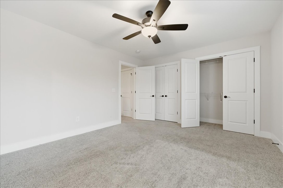 427 Bee Cv Way Pendleton, SC 29670 - Photo 27 of 32 A well-proportioned bedroom with soft gray carpeting and ample closet space provides a serene retreat.