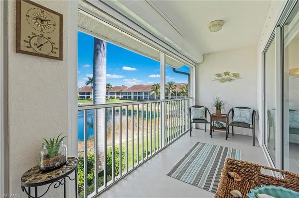 a view of a balcony with furniture