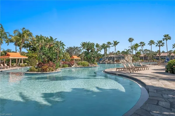 a view of a swimming pool with a yard