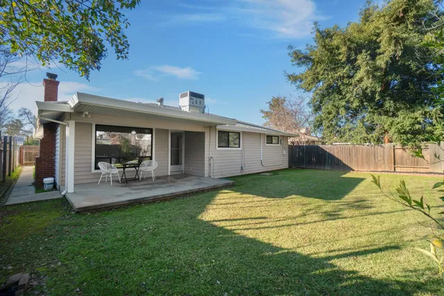 a balcony with table and chairs
