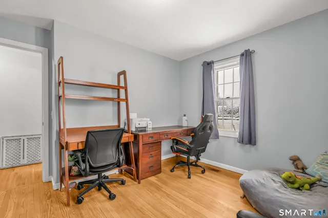 a workspace with furniture and a window