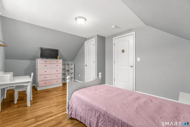 a bedroom with a bed and furniture