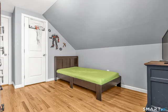 a bedroom with a bed and a dresser