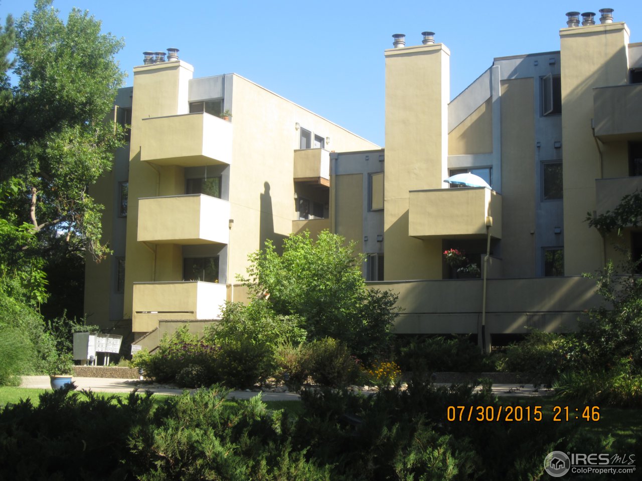 2711 Mapleton Avenue, Unit 1 Boulder, CO 80304 - Photo 2 of 9 a front view of a building with an outdoor space and seating area