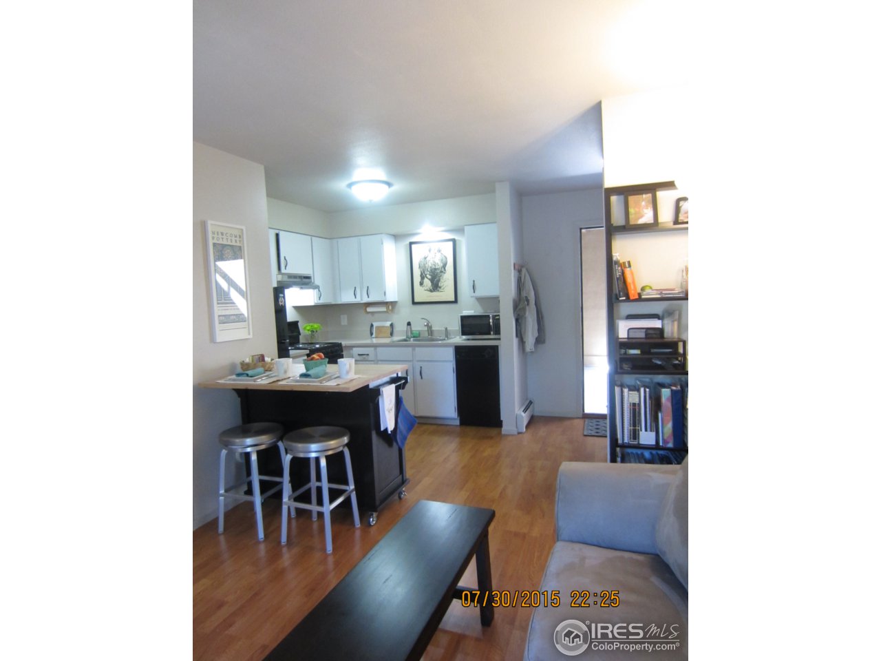 2711 Mapleton Avenue, Unit 1 Boulder, CO 80304 - Photo 5 of 9 a kitchen with a dining table chairs and a refrigerator