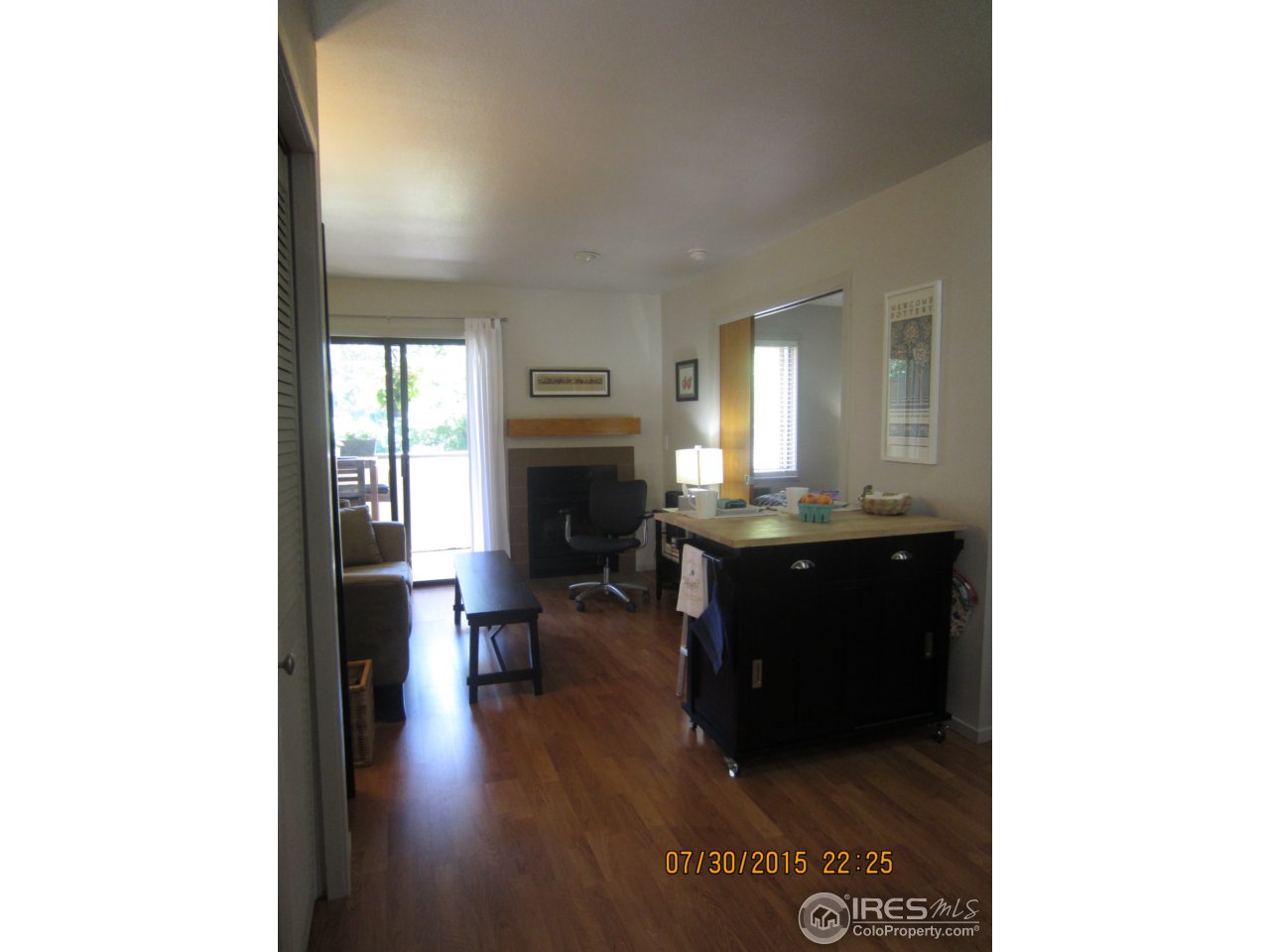2711 Mapleton Avenue, Unit 1 Boulder, CO 80304 - Photo 6 of 9 a living room with a couch and a fireplace