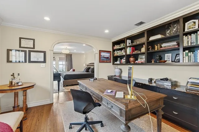 a work room with furniture and book shelf