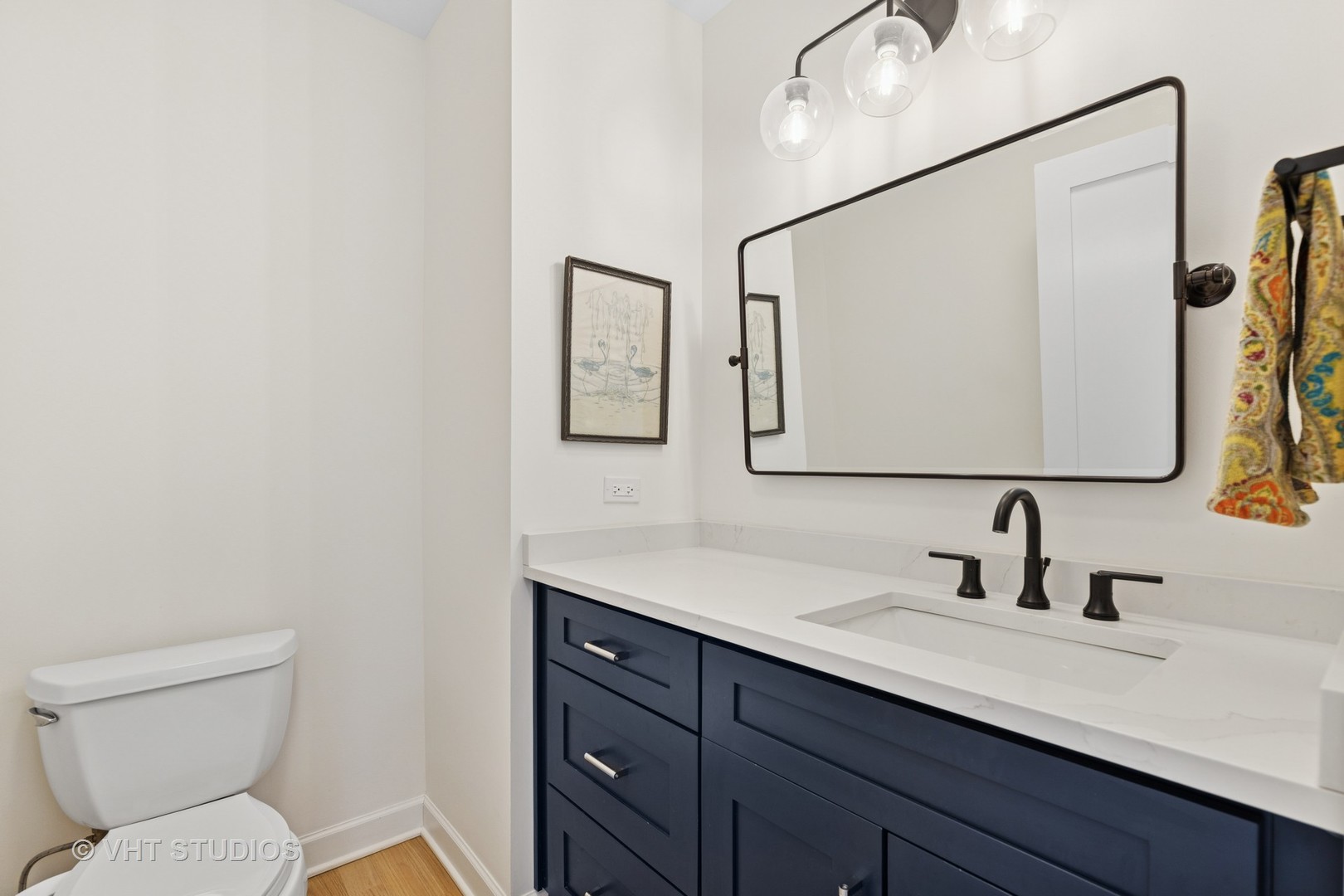 21 East Huron Street, Unit 1806 Chicago, IL 60611 - Photo 13 of 54 a bathroom with a toilet sink and mirror