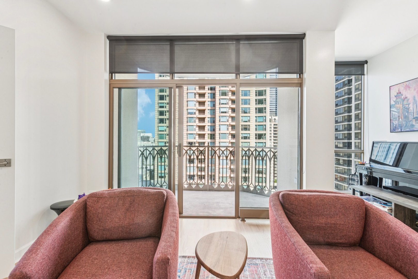 21 East Huron Street, Unit 1806 Chicago, IL 60611 - Photo 22 of 54 a living room with furniture and a floor to ceiling window