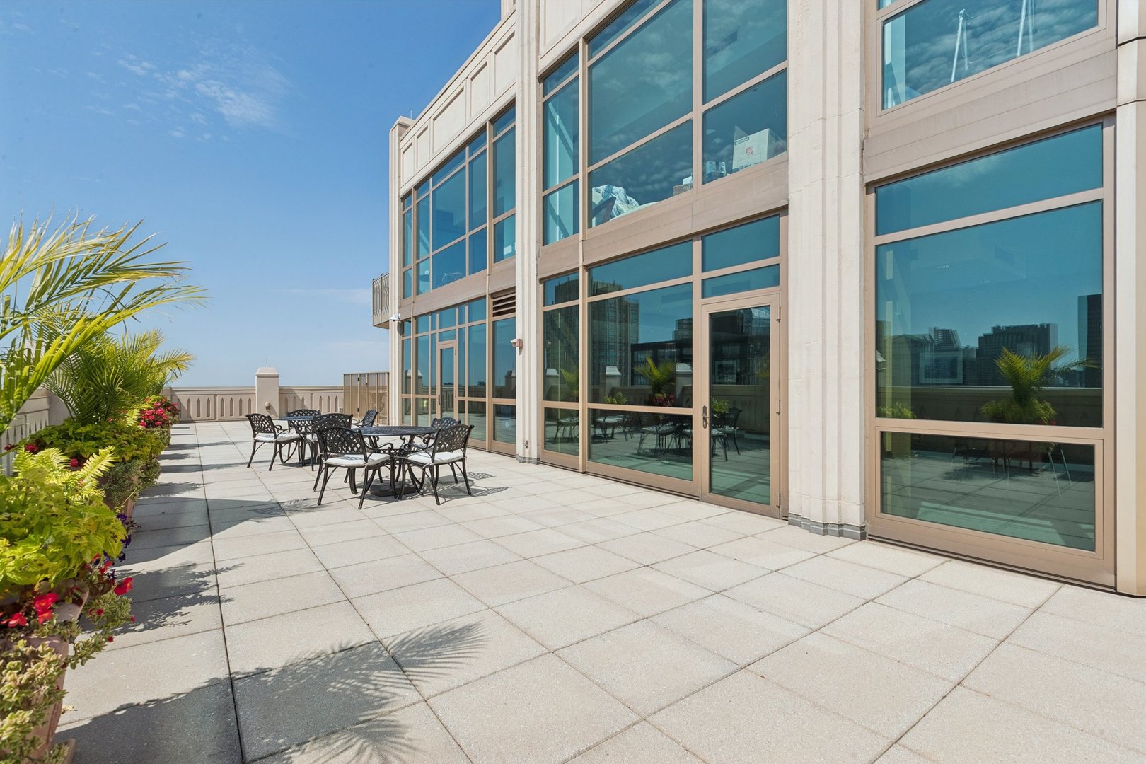 21 East Huron Street, Unit 1806 Chicago, IL 60611 - Photo 32 of 54 a view of balcony with chairs and tables
