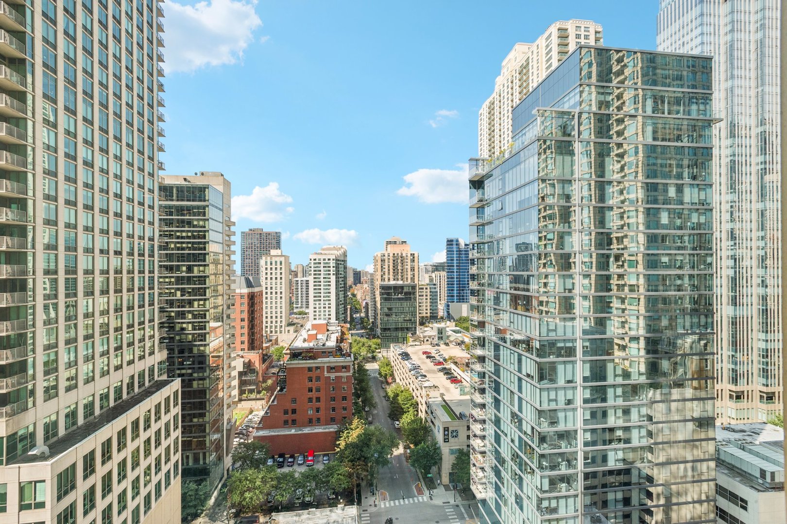 21 East Huron Street, Unit 1806 Chicago, IL 60611 - Photo 40 of 54 a view of a city with tall buildings
