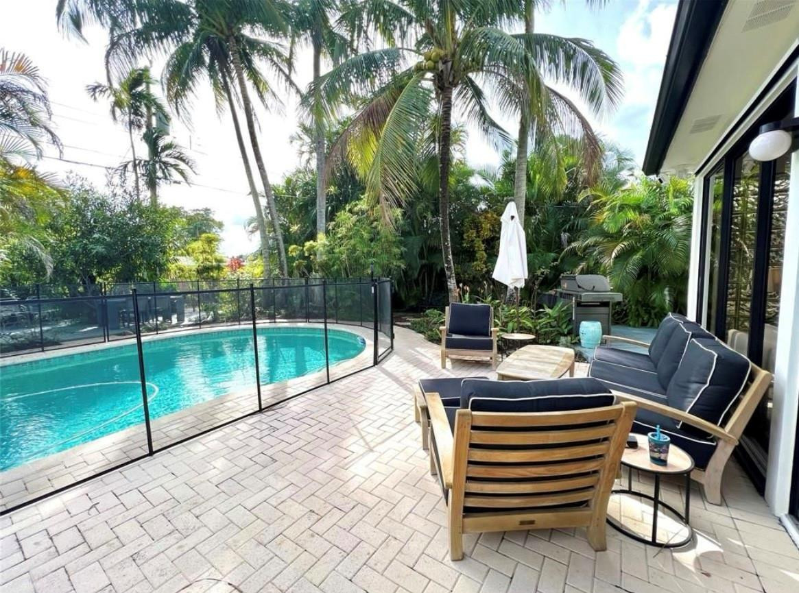 4408 Monroe Street Hollywood, FL 33021 - Photo 20 of 26 a view of outdoor space yard deck patio and swimming pool