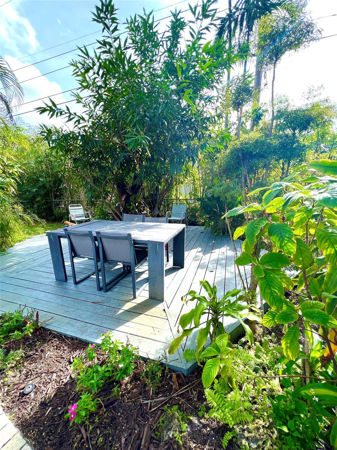 4408 Monroe Street Hollywood, FL 33021 - Photo 23 of 26 a view of backyard with outdoor seating and green space
