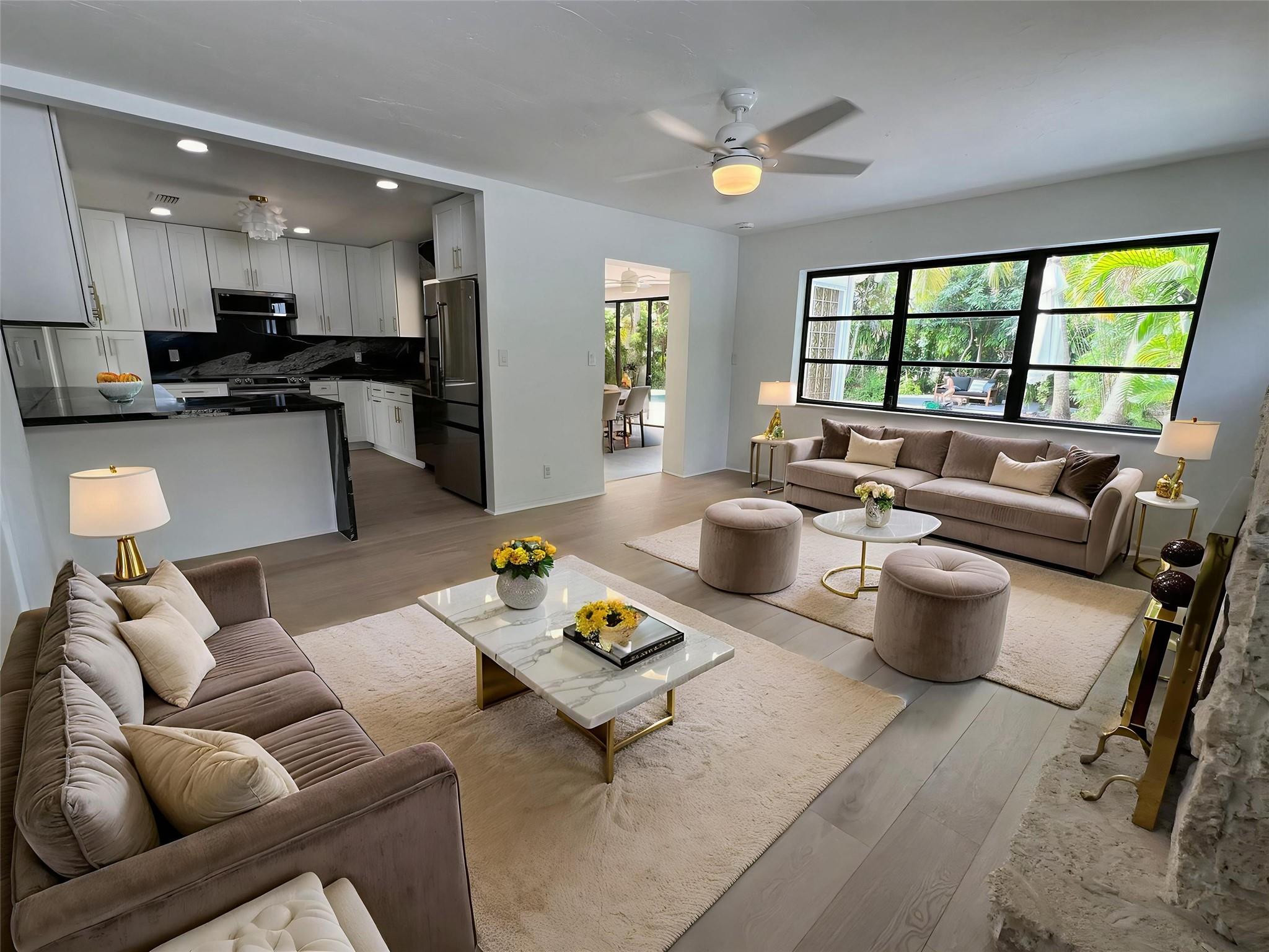 4408 Monroe Street Hollywood, FL 33021 - Photo 4 of 26 a living room with furniture and a large window