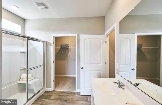 a bathroom with a bathtub and a sink