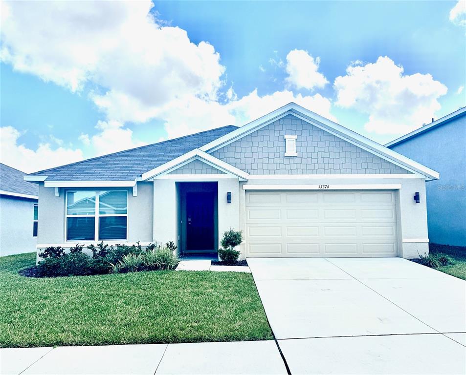 13374 Mylion Way Spring Hill, FL 34610 - Photo 1 of 39 a front view of house with yard