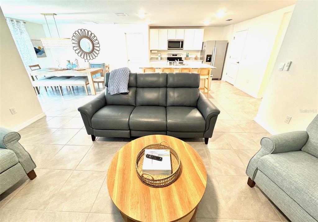 13374 Mylion Way Spring Hill, FL 34610 - Photo 13 of 39 a living room with a couch and a table