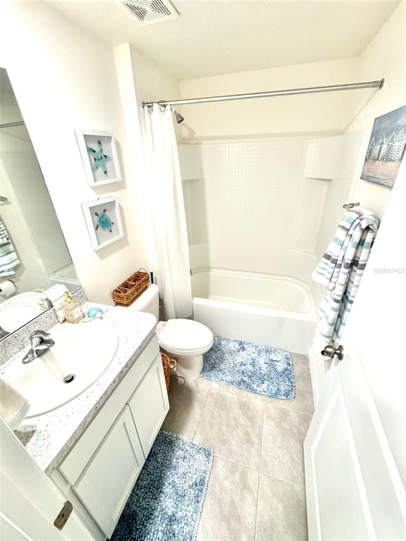 13374 Mylion Way Spring Hill, FL 34610 - Photo 28 of 39 a bathroom with a sink toilet and shower