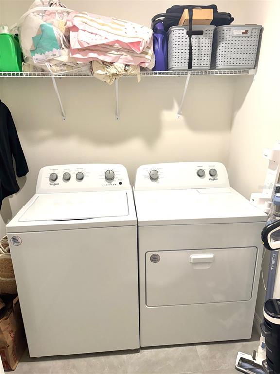 13374 Mylion Way Spring Hill, FL 34610 - Photo 33 of 39 a utility room with dryer and washer