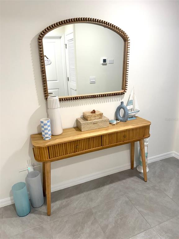 13374 Mylion Way Spring Hill, FL 34610 - Photo 4 of 39 a bathroom with a sink and a mirror