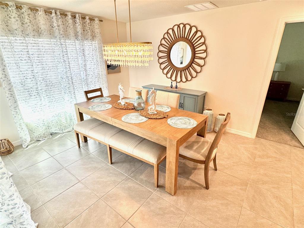 13374 Mylion Way Spring Hill, FL 34610 - Photo 9 of 39 a view of a dining area with furniture