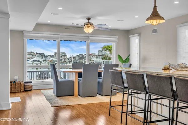 a dining room with furniture and a chandelier