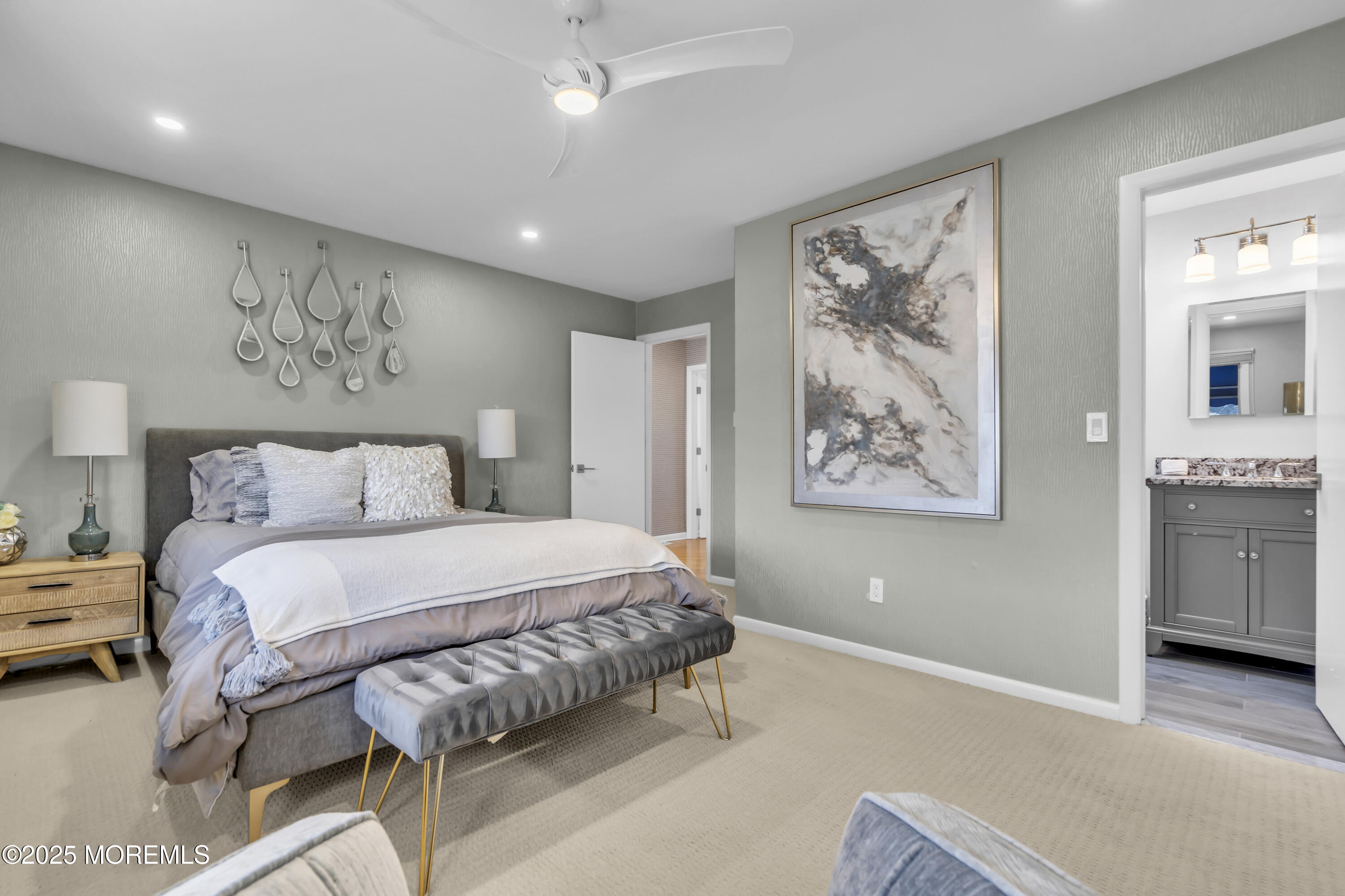 254 Harbor Court Lavallette, NJ 08735 - Photo 33 of 47 a bedroom with a large bed and a chandelier