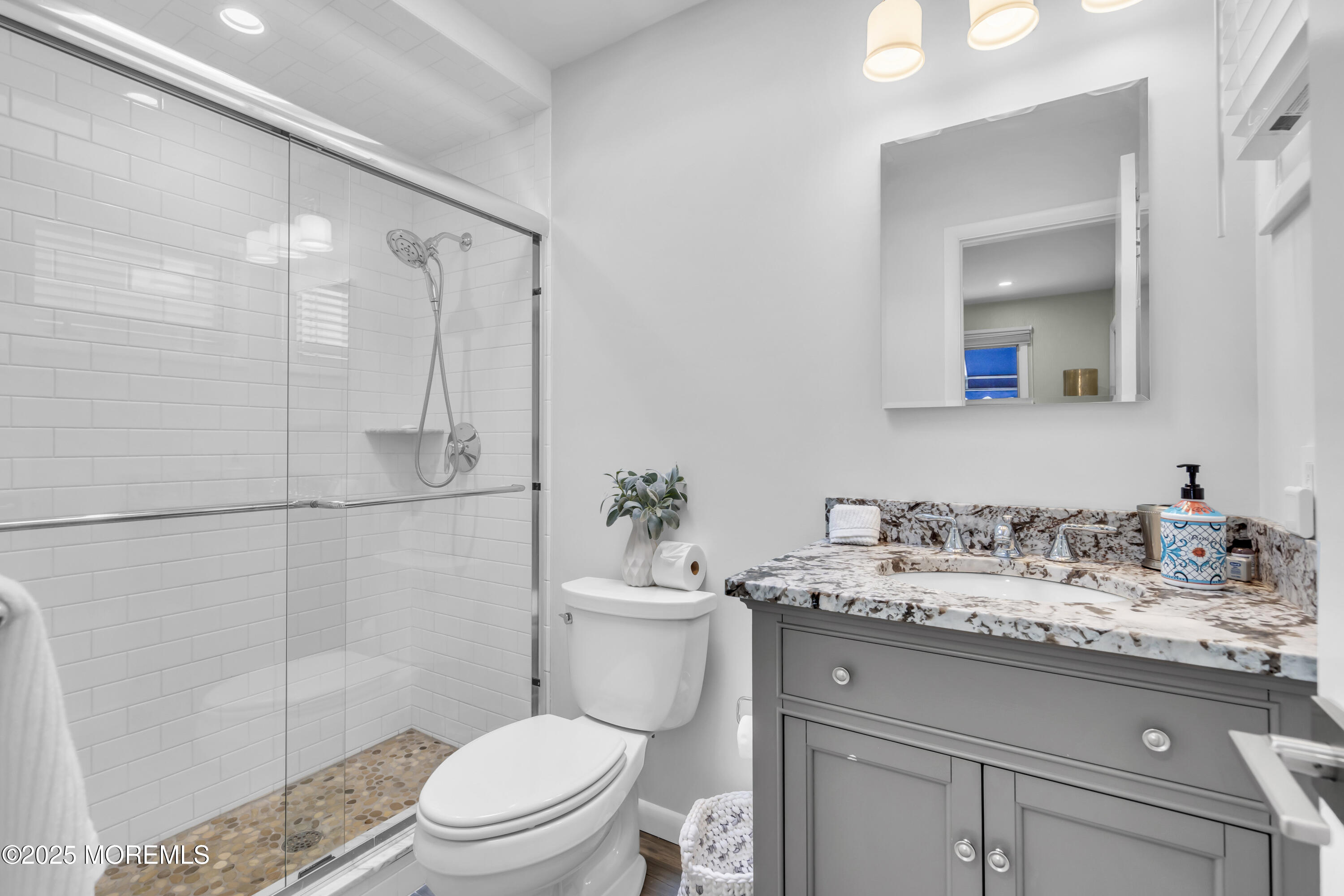 254 Harbor Court Lavallette, NJ 08735 - Photo 34 of 47 a bathroom with a sink a toilet and shower