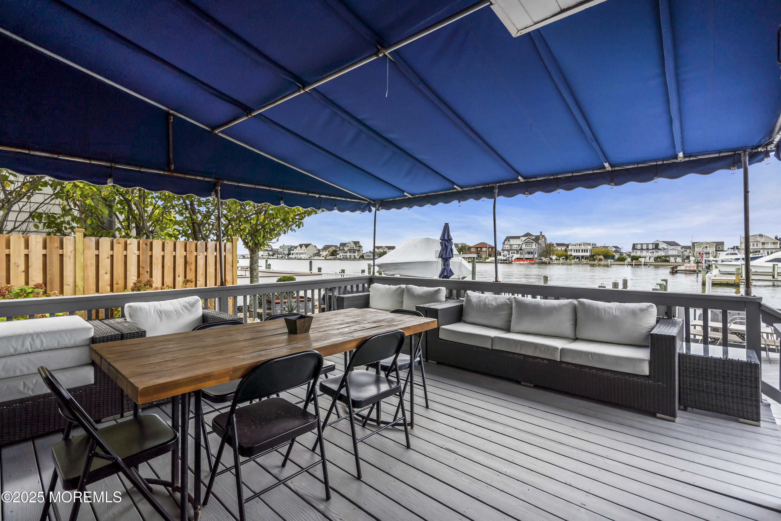 254 Harbor Court Lavallette, NJ 08735 - Photo 41 of 47 a view of a patio with a table and chairs under an umbrella