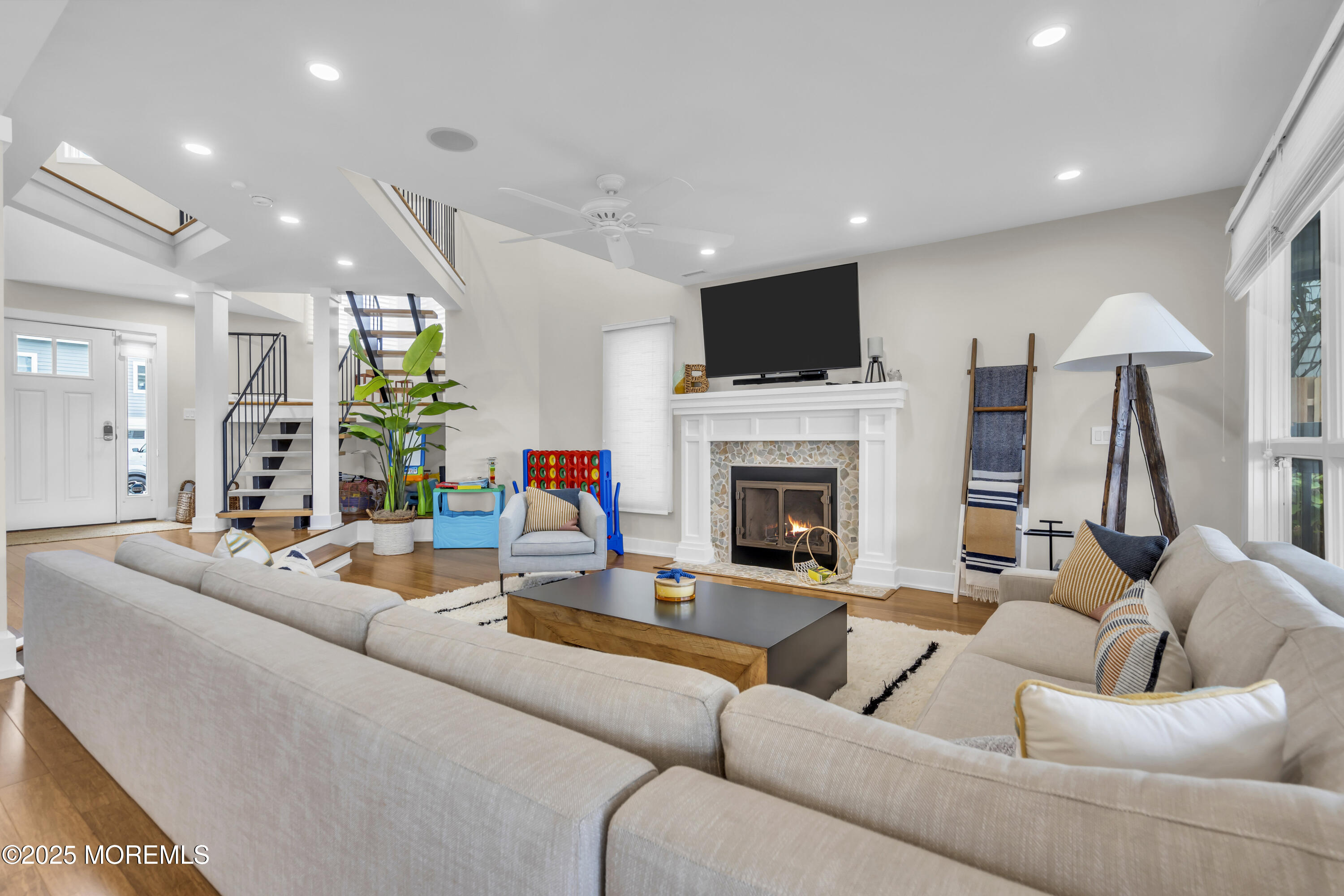254 Harbor Court Lavallette, NJ 08735 - Photo 5 of 47 a living room with furniture a fireplace and a flat screen tv