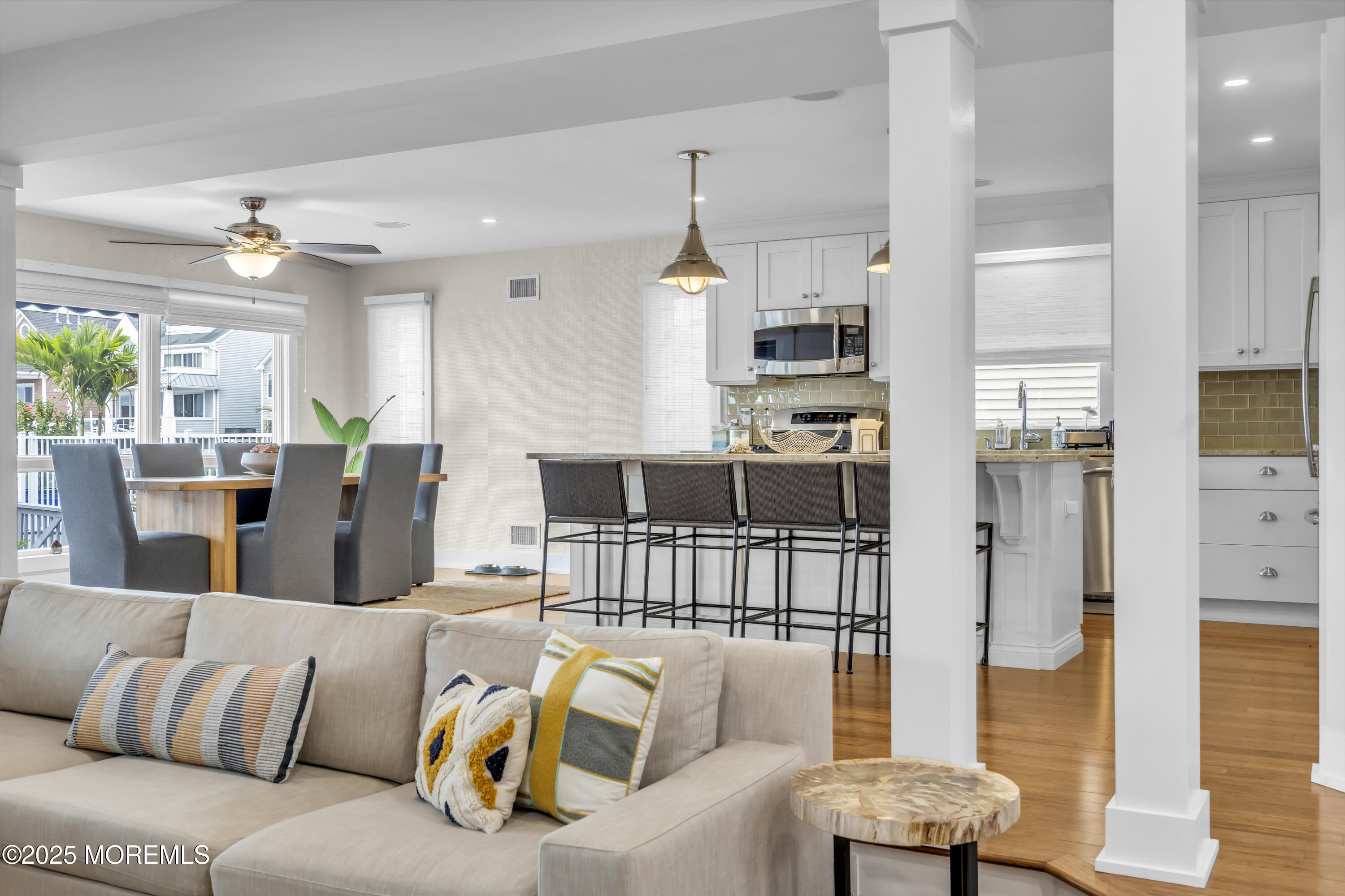 254 Harbor Court Lavallette, NJ 08735 - Photo 6 of 47 a living room with furniture kitchen view and a chandelier