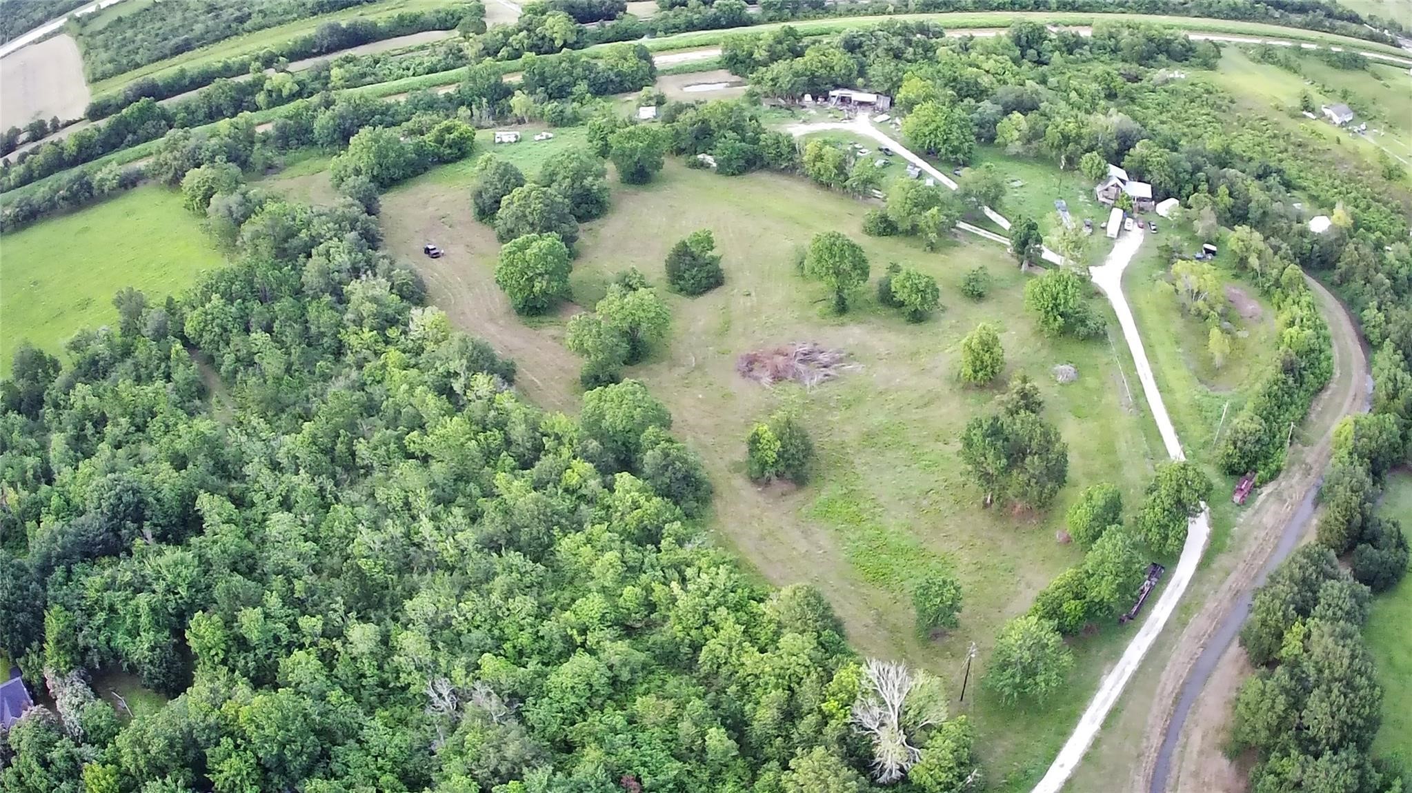 5355 County Road 418 Manvel, TX 77583 - Photo 2 of 12 an aerial view of residential houses with outdoor space and trees
