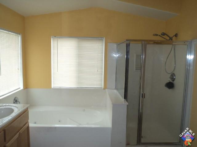 5753 Monaco Drive Palmdale, CA 93552 - Photo 14 of 29 a bathroom with a bathtub and a sink