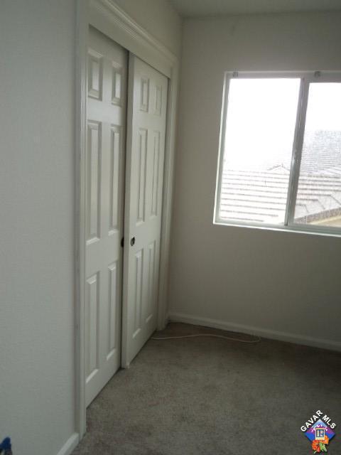 5753 Monaco Drive Palmdale, CA 93552 - Photo 15 of 29 a view of an empty room with a window